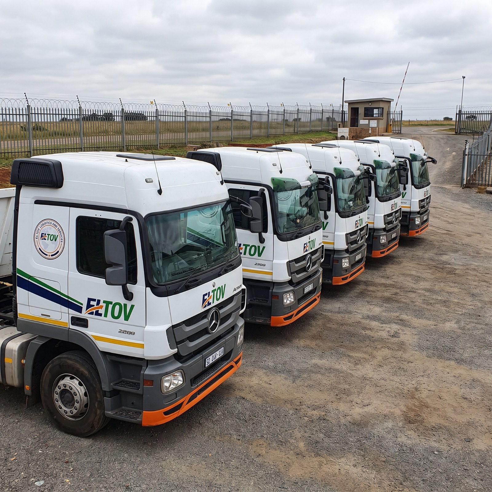 El Tov tri-axle truck fleet on a cross-border freight corridor