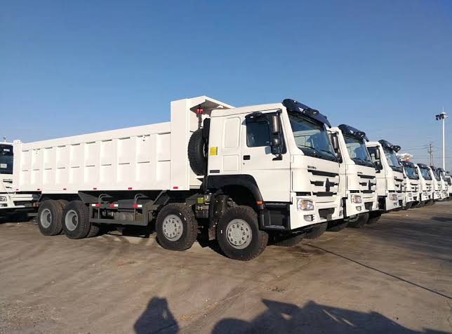 Row of El Tov 12-wheeler dump trucks ready for mining deployment